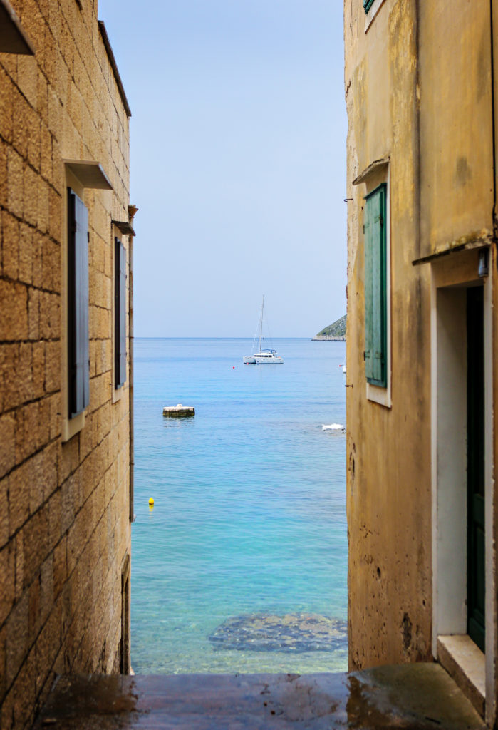 Peeking at the sea through the buildings on Vis.