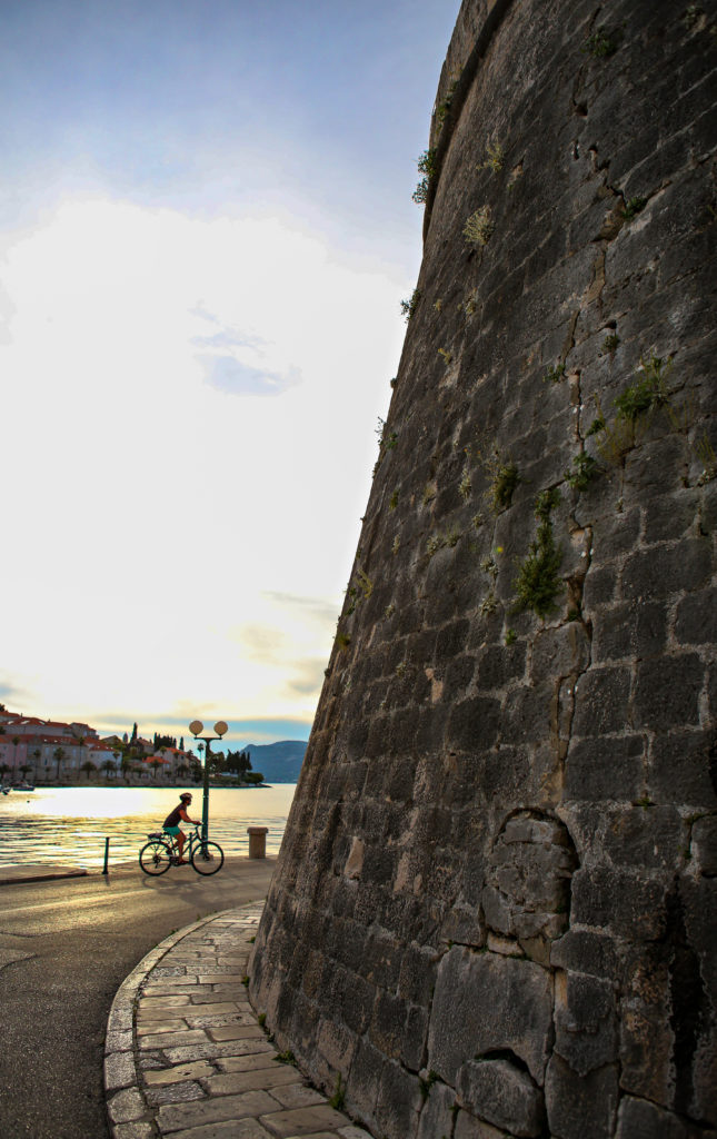 Sunset ride in Korcula, along the harbor by the old fortress walls.